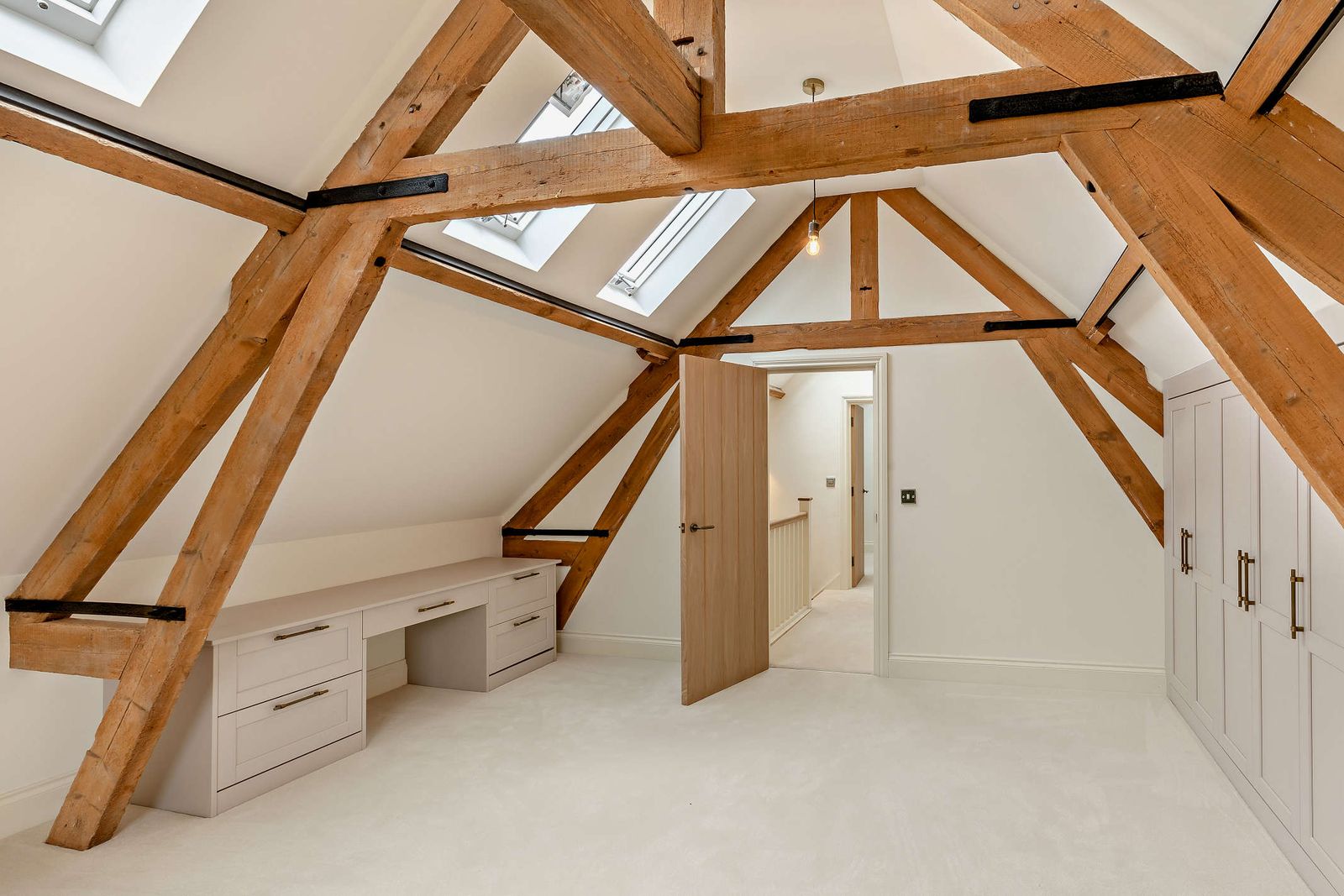 Bedroom under exposed oak trusses