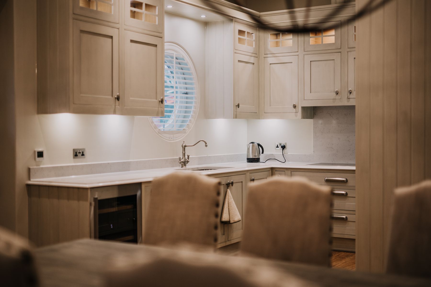 Oak kitchen with a round window